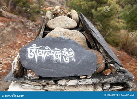 Mani Wall and Stone with Buddhist Symbols, Nepal Stock Photo - Image of ...