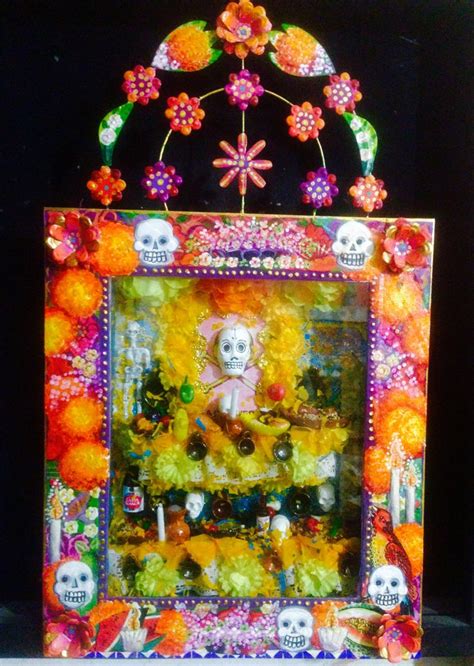 A Colorful Frame With Skulls And Flowers On It In Front Of A Black