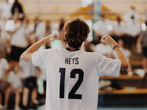 Download Volleyball Player In White Jersey Wallpaper