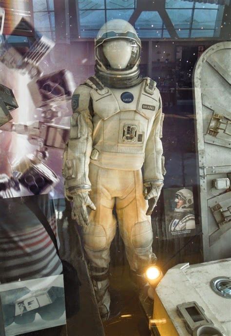 An Astronauts Space Suit Is Displayed In A Window