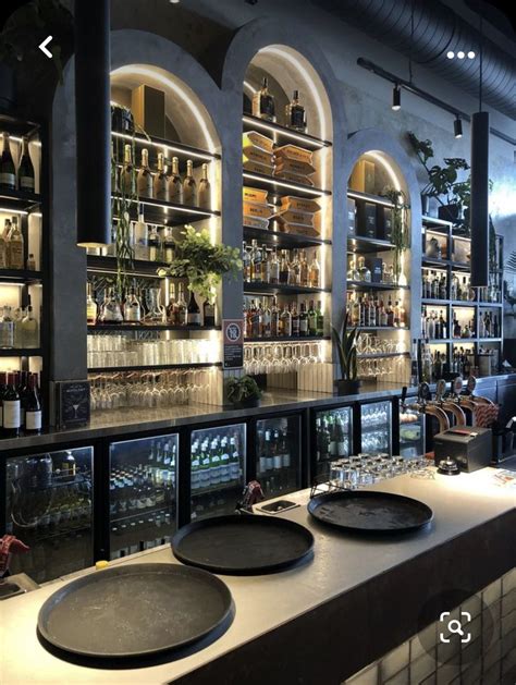 An Empty Bar With Plates On The Counter