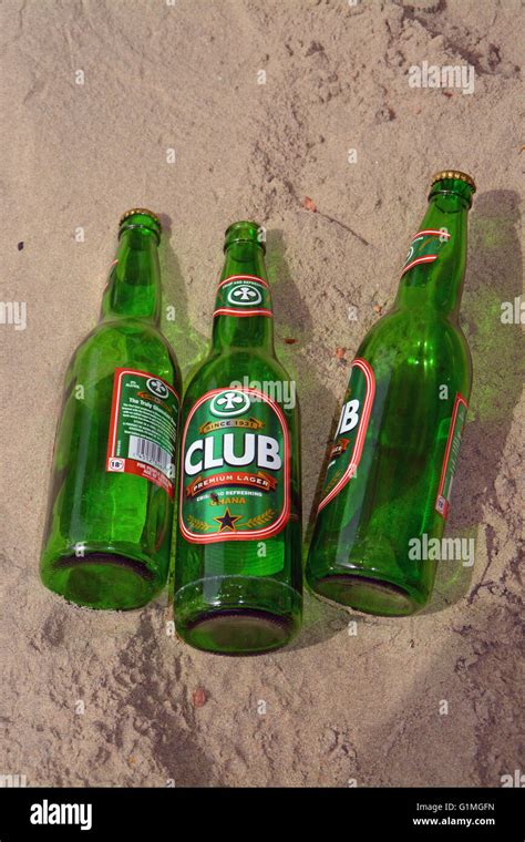 3 Empty Club Beer Bottles On The Beach Of Ghana Stock Photo Alamy