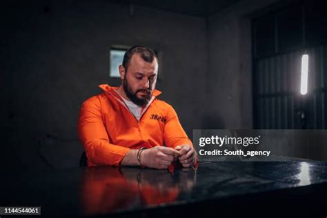 348 Orange Suit Prisoner Stock Photos, High-Res Pictures, and Images ...