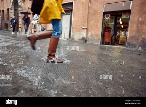 Happy Running And Jumping On Puddles On A Rainy Dayrainy Day Outdoors