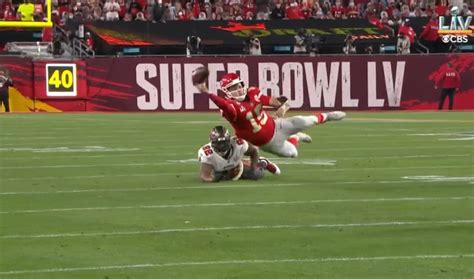 Photo Patrick Mahomes Throwing Ball While Falling Face Down In The Turf