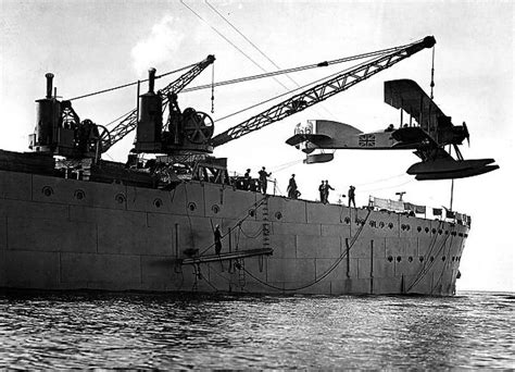 Hoisting Out A Seaplane From British Seaplane Carrier Hms