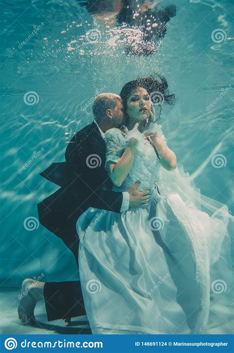 Beautiful Romantic Couple Of Bride And Groom After Wedding Swimming