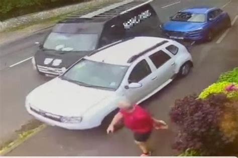 Video Pedestrian Narrowly Avoids Serious Injury After A Van Collides With Two Parked Cars In