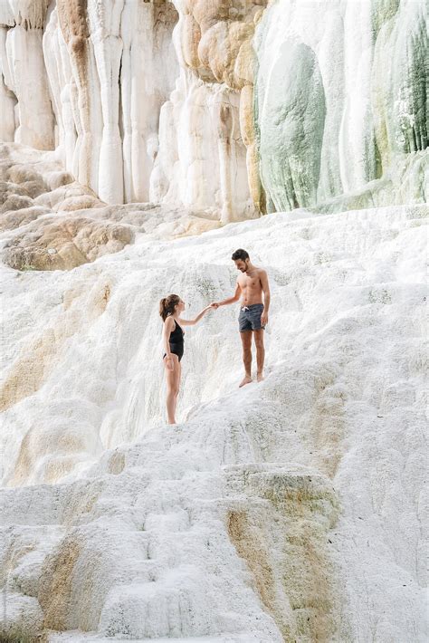 Couple Relaxing In Natural Hot Springs By Stocksy Contributor Studio Marmellata Stocksy