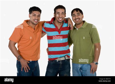 Friends with arm around, smiling, portrait Stock Photo - Alamy