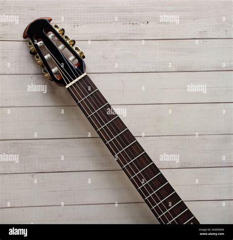 Acoustic Guitar Fretboard On Wooden Background Space For Text Stock