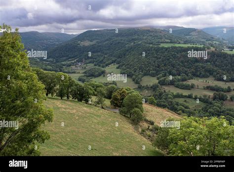 Country Landscape In Auvergne France With Mountains Forests And