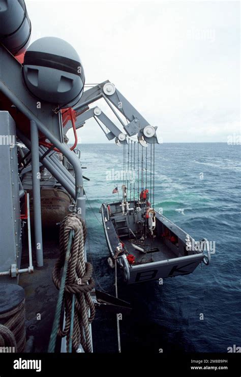 A 35 Foot Work Boat Is Lowered From The Port Side Of The Salvage And Rescue Ship Uss Brunswick