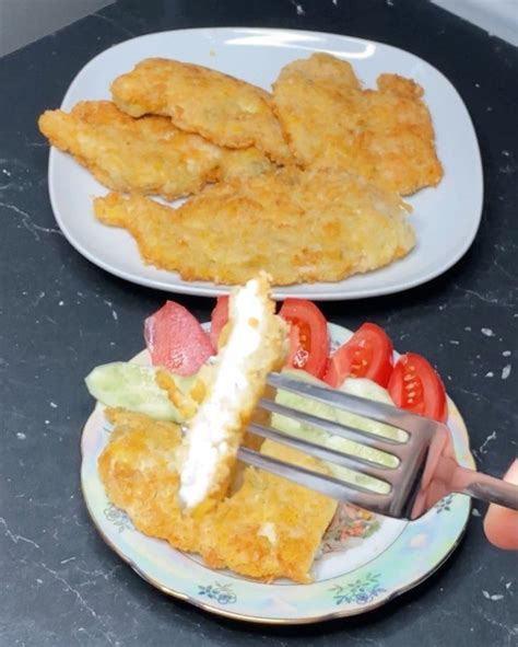 Two Plates With Food On Them One Has Chicken Strips And The Other Has