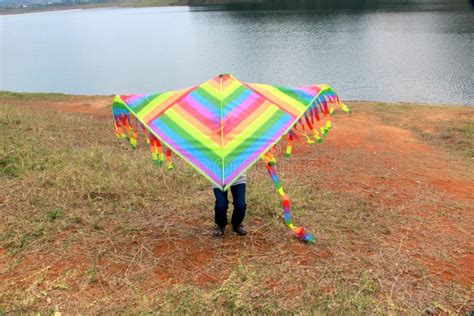 Latino Man Flying Multicolored Kite At El Vigilante Viewpoint And In