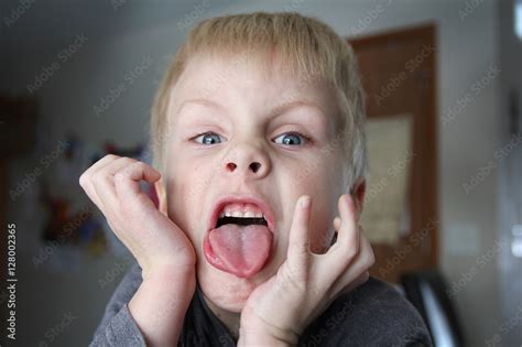 Funnt Bratty Kid Sticking Out His Tongue Stock Photo | Adobe Stock