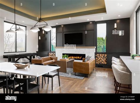 Community Room In Apartment Building With Firelace And Tv Seating Area