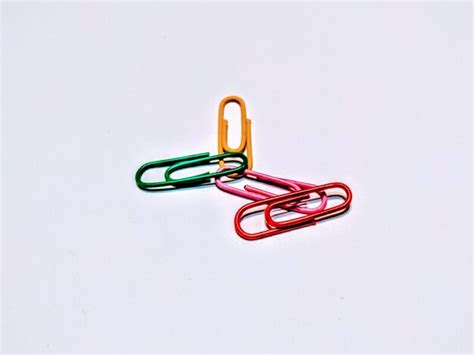 Premium Photo Multi Colored Paper Clips On White Background