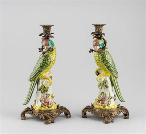 Lot A Pair Of Brass Mounted Porcelain Candlesticks In The Form Of Parrots 15 In 38 10 Cm