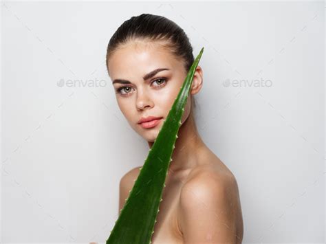 Nude Woman Clean Skin Cosmetology And Green Aloe Leaf On Light Background Stock Photo By Shotprime