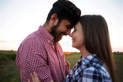 Embracing Couple In Rays Of Setting Sun Stock Image Image Of Smiling