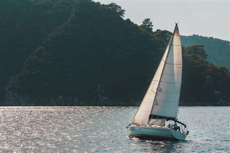 Premium Photo Sailing Yacht With White Sails On A Wavy Sea Bay On