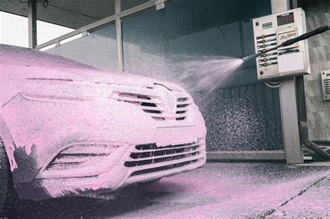 Premium Photo Hand Washing Car With Pink Foam Advertising