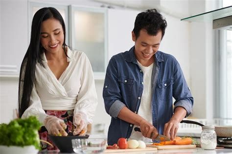 Premium Photo Couple Cooking Dinner Together