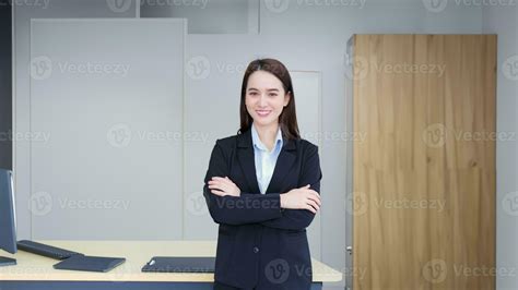 Asian Professional Working Woman Who Has Long Hair Wears Black Formal