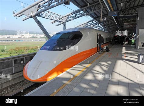 A Passenger Boards A High Speed Hsr Bullet Train At Taichung Station