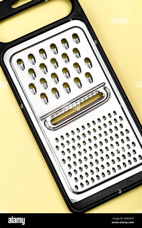 Stainless steel cheese grater Stock Photo - Alamy