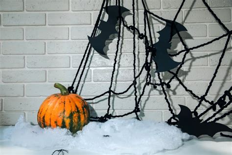 Pumpkin Web With Spiders And Bats On A White Table Against A White