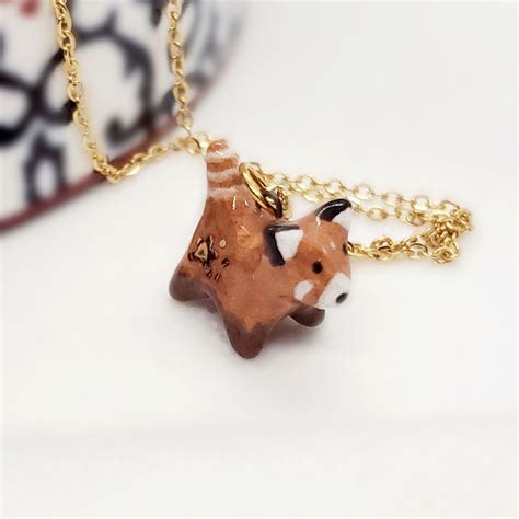 This Red Panda Pendant Charm Is Handmade With Ceramic Clay And Fired