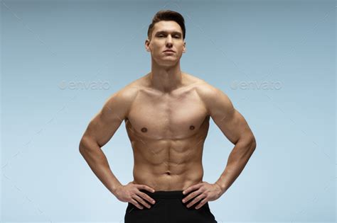 Strong Athletic Man Fitness Model Posing With Naked Torso Showing Six