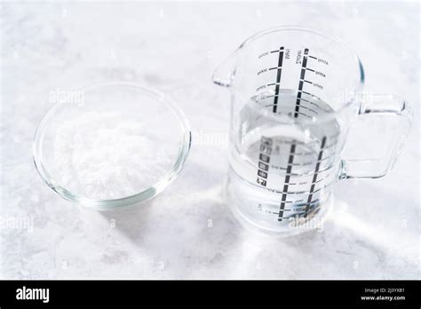 Baking Soda And Vinegar In Glass Containers For Cleaning Cast Iron