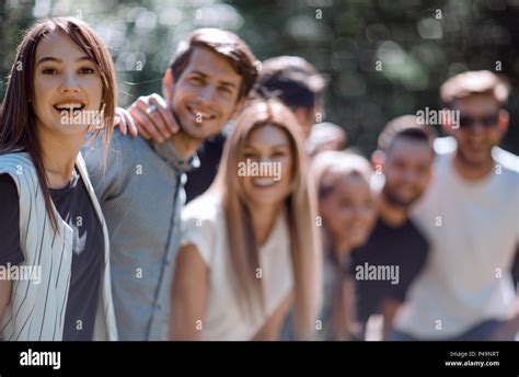 young woman and a group of friends Stock Photo - Alamy