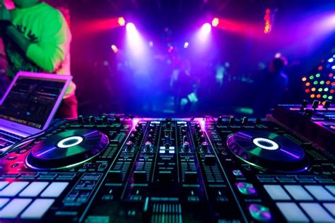 Premium Photo | Professional dj music mixer at a party at an electronic ...