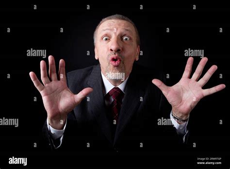 Scared Mature Businessman Looking At Camera Stock Photo Alamy
