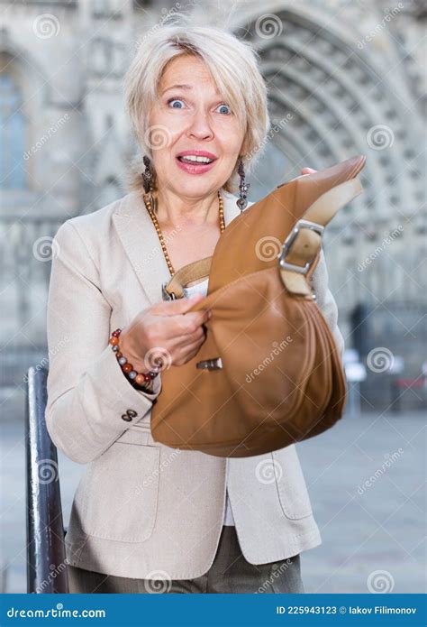 Mature Female Is Displeased Of Theft From Her Bag Stock Image Image