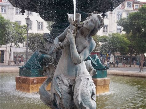 Mermaid Statues Fountains At Rossio Square In Lisbon Spain