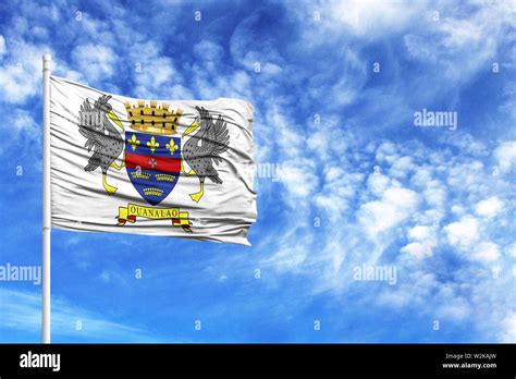 National Flag Of Saint Barthelemy On A Flagpole In Front Of Blue Sky