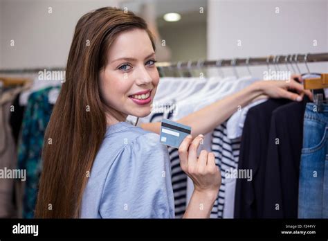 Brunette Shopping And Holding Credit Card Stock Photo Alamy
