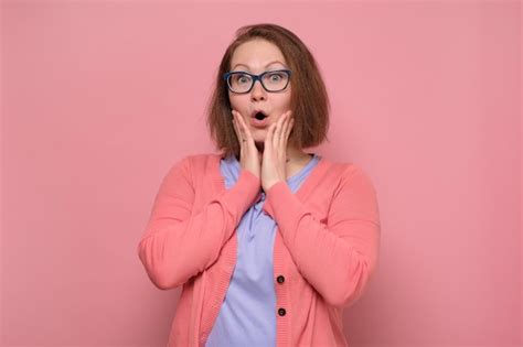 Premium Photo Shocked Girl Covers Her Mouth With Hands