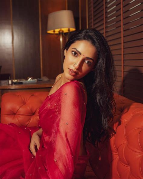Neha Shetty Oozes Panache In Red Hot Saree
