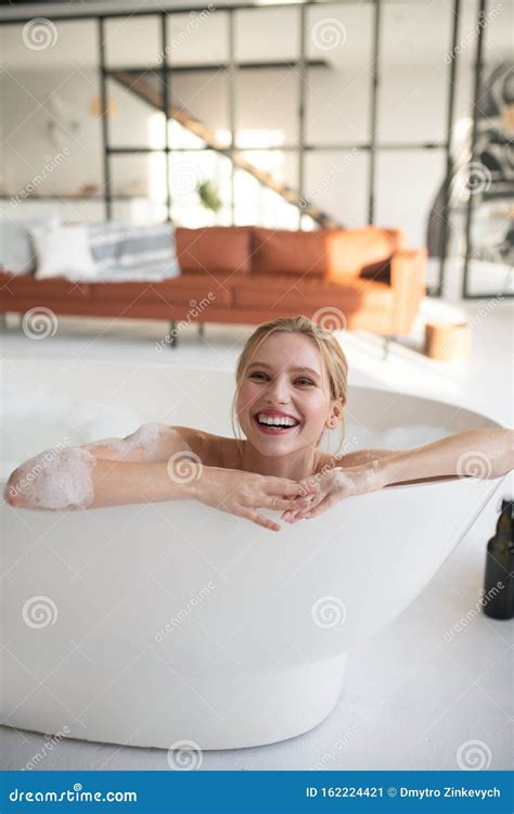 Woman Feeling Happy While Relaxing In Bath With Foam Stock Image