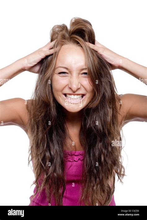 Jeune Femme Tournant Les Doigts Dans Ses Cheveux Making A Face Photo