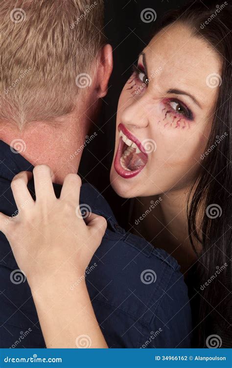 Female Vampire Bite Mans Neck Look Stock Photography - Image: 34966162