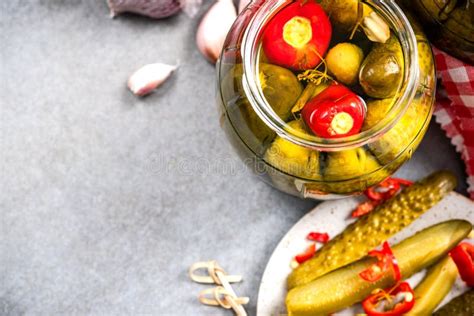 Pickled Cucumber Gherkins With Hot Chili Pepper In Jar Stock Image