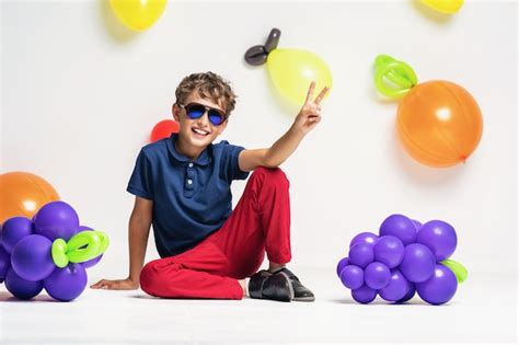 Premium Photo | Stylish boy in sunglasses and fashionable clothes