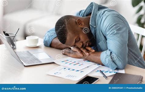 Sleep At Work Exhausted Black Freelancer Napping At Desk At Home